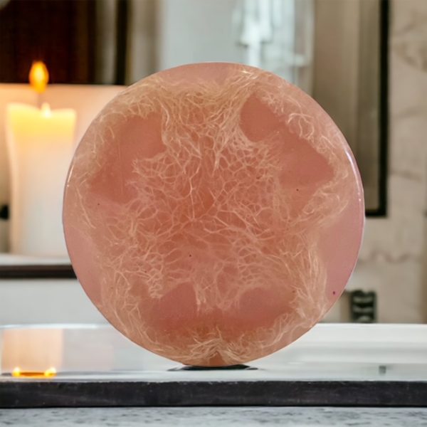 A pink round object sitting on top of a table.