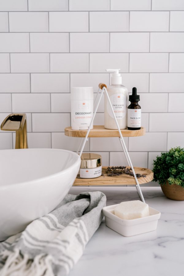 A bathroom with white tile and a sink